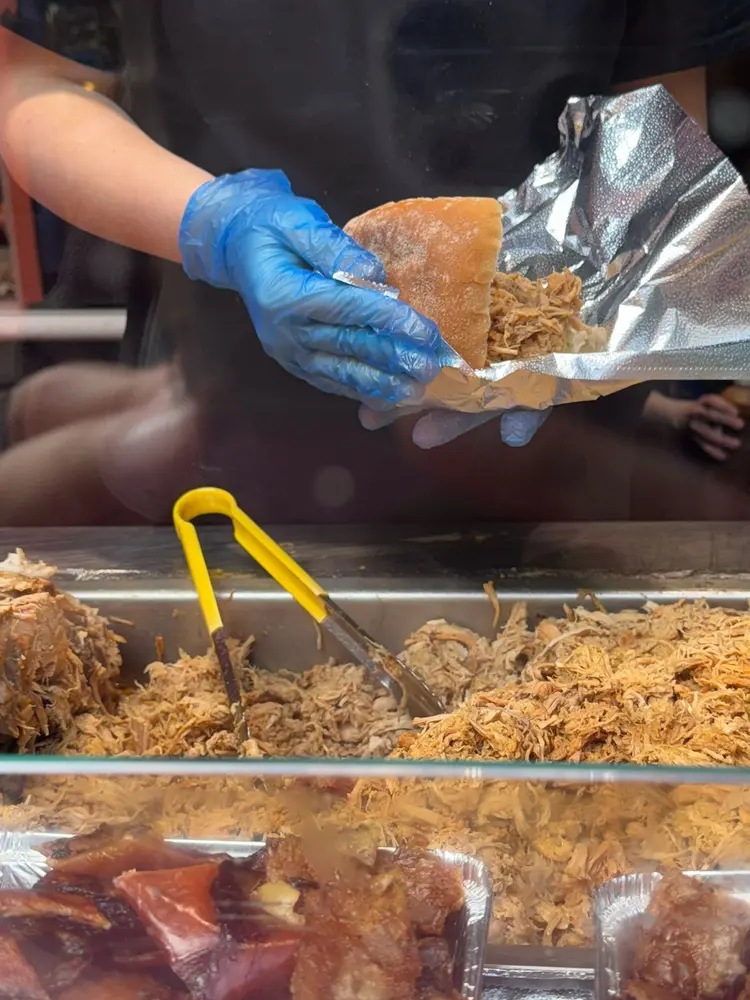 Roll being wrapped fresh in foil at the counter